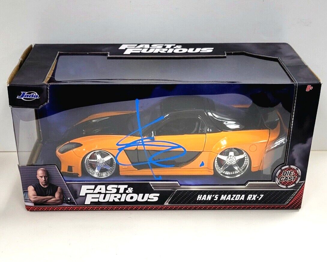 Beckett Authenticated Sung Kang Signature Fast and Furious Mazda RX-7 Die Cast Car: Beckett Authenticated Sung Kang Signature Fast and Furious Mazda RX-7 Die Cast Car This is a pre-owned die cast model of the Mazda RX-7 from the movie Fast & Furious, personally signed by Sung Kang. T