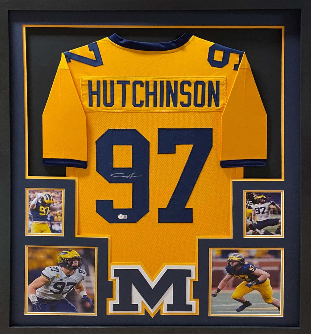Framed Michigan Jersey Signed by Aidan Hutchinson Beckett Authenticated: Framed Michigan Jersey Signed by Aidan Hutchinson Beckett Authenticated This framed Michigan yellow jersey is autographed by Aidan Hutchinson and authenticated by Beckett, featuring a tamper-proof sti