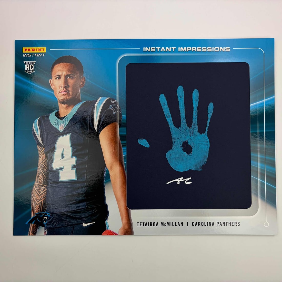 Oversized Panini Impressions Tetairoa McMillan Rookie Hand Print Autograph Card /10: Oversized Panini Impressions Tetairoa McMillan Rookie Hand Print Autograph Card /10 This 2025 Panini Impressions Tetairoa McMillan rookie card is an oversized collectible featuring a hand print and au