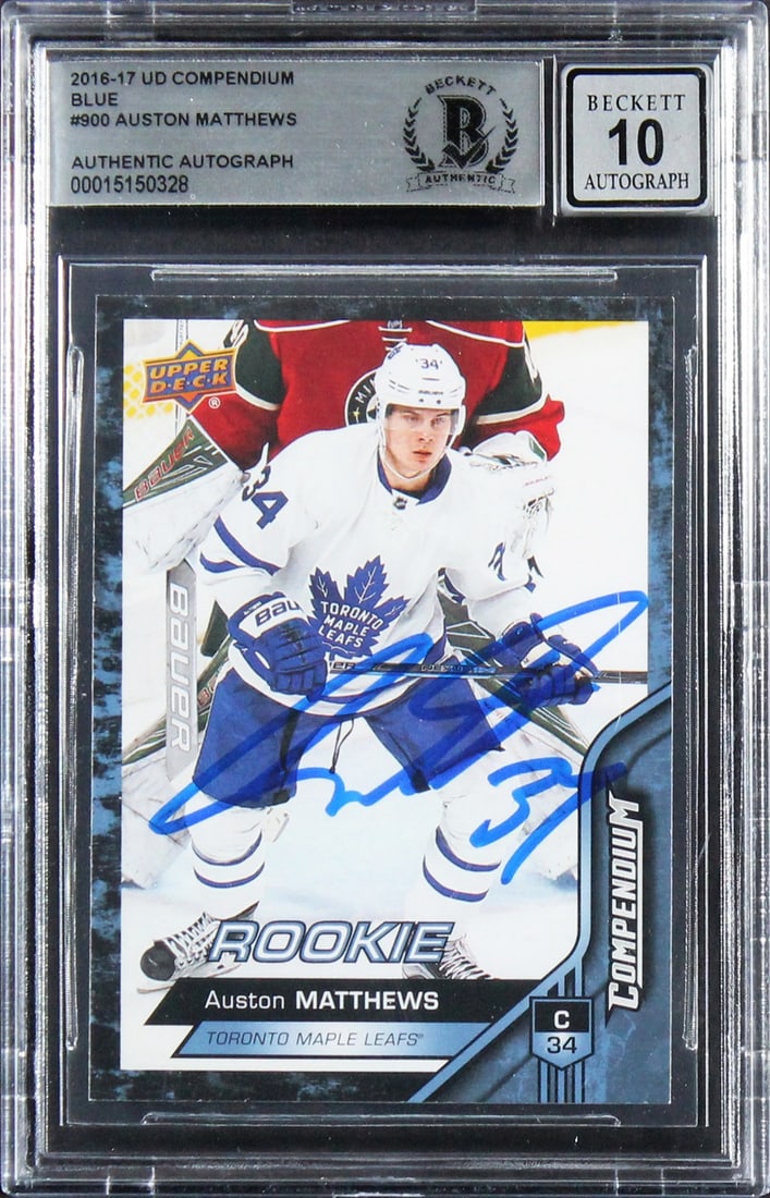 Auston Matthews 2016 UD Compendium Blue RC Card Auto 10 Beckett Authenticated: Auston Matthews 2016 UD Compendium Blue RC Card Auto 10 Beckett Authenticated This is a 2016 Upper Deck Compendium Blue #900 rookie card of Auston Matthews, personally signed by the Toronto Maple Leaf