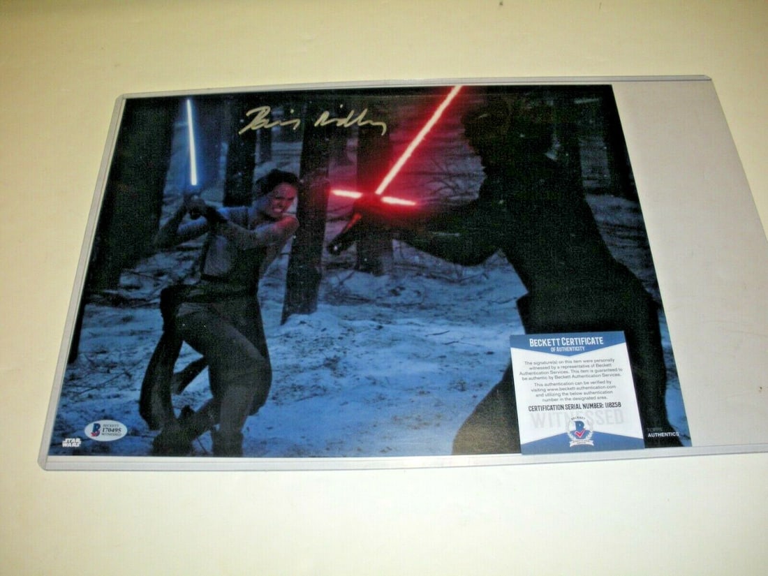 Daisy Ridley Signed 11x14 Star Wars Rey Photo Beckett COA: Daisy Ridley Signed 11x14 Star Wars Rey Photo Beckett COA This is an original 11x14 photo signed by Daisy Ridley, known for her role as Rey in the Star Wars series. The photo comes with Beckett authen