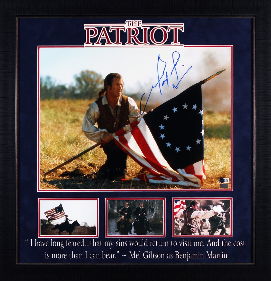 Mel Gibson Signed 16x20 Framed The Patriot Flag Photo BAS COA: Mel Gibson Signed 16x20 Framed The Patriot Flag Photo BAS COA Capture a piece of cinematic history with this authentic 16x20 framed photograph featuring Mel Gibson in 'The Patriot'. Personally signed