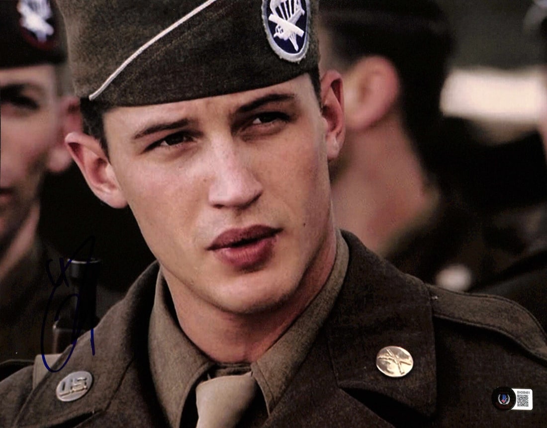 Tom Hardy Signed 11x14 Band of Brothers Photo Beckett Certified: Tom Hardy Signed 11x14 Band of Brothers Photo Beckett Certified This 11x14 color photograph features Tom Hardy as PFC John Janovec from the acclaimed mini-series Band of Brothers. The photo is signed