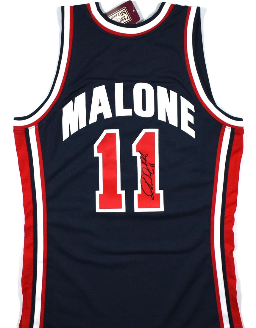 Autographed Team USA Blue Jersey by Karl Malone with Beckett Witness Hologram: Autographed Team USA Blue Jersey by Karl Malone with Beckett Witness Hologram This is an original Mitchell & Ness blue Team USA jersey signed by Karl Malone. The jersey is authenticated with a Beckett