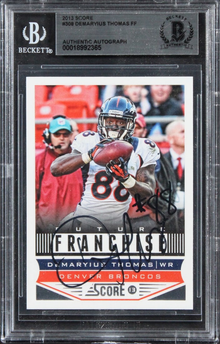 Demaryius Thomas Autographed 2013 Score Card #308 Beckett Authenticated Slab: Demaryius Thomas Autographed 2013 Score Card #308 Beckett Authenticated Slab This is an original 2013 Score #308 football card that has been personally signed by Demaryius Thomas of the Denver Broncos