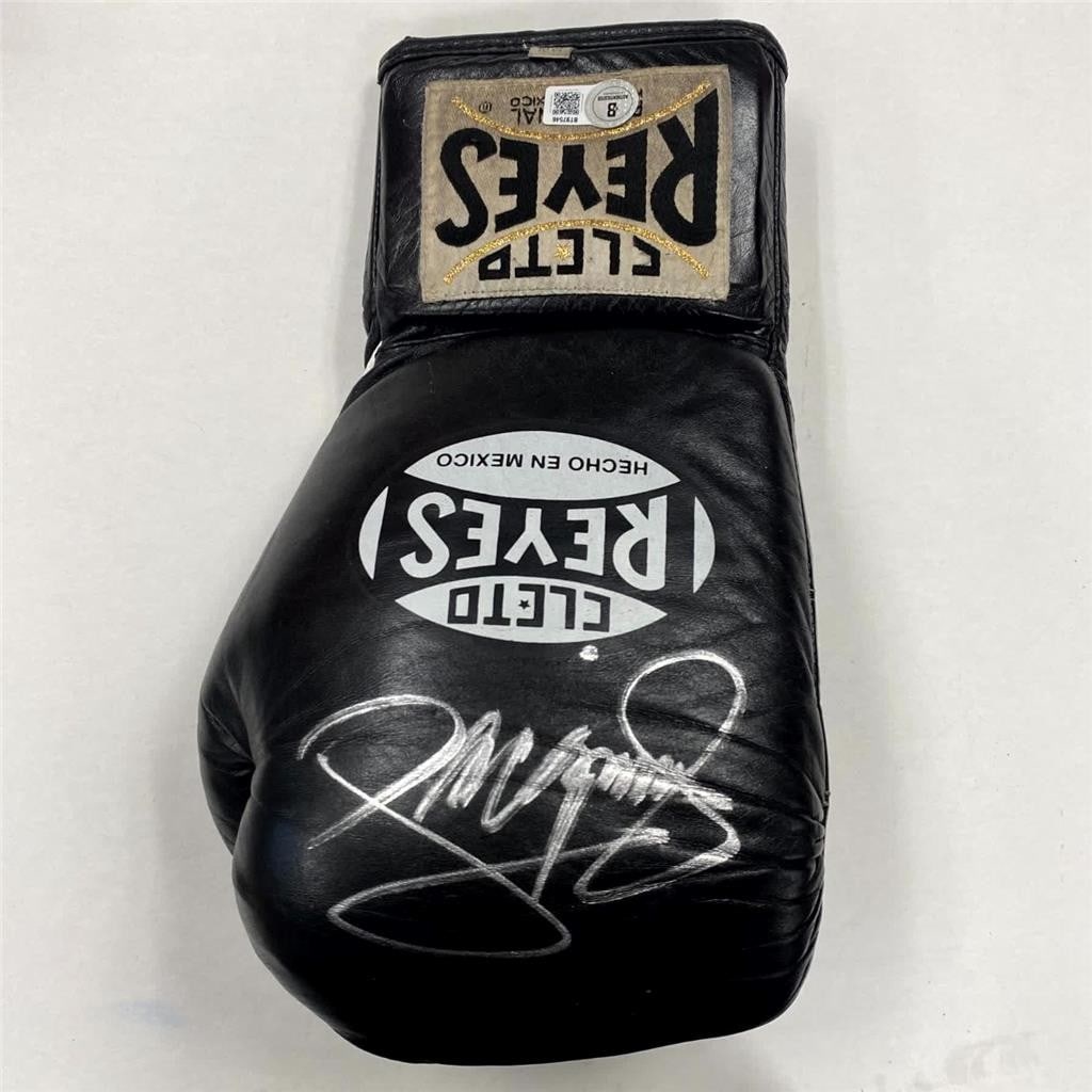 Cleto Reyes boxing glove with Manny Pacquiao signature Beckett authenticated: Cleto Reyes boxing glove with Manny Pacquiao signature Beckett authenticated This original Cleto Reyes boxing glove features the autograph of legendary boxer Manny Pacquiao. The signature is authentic
