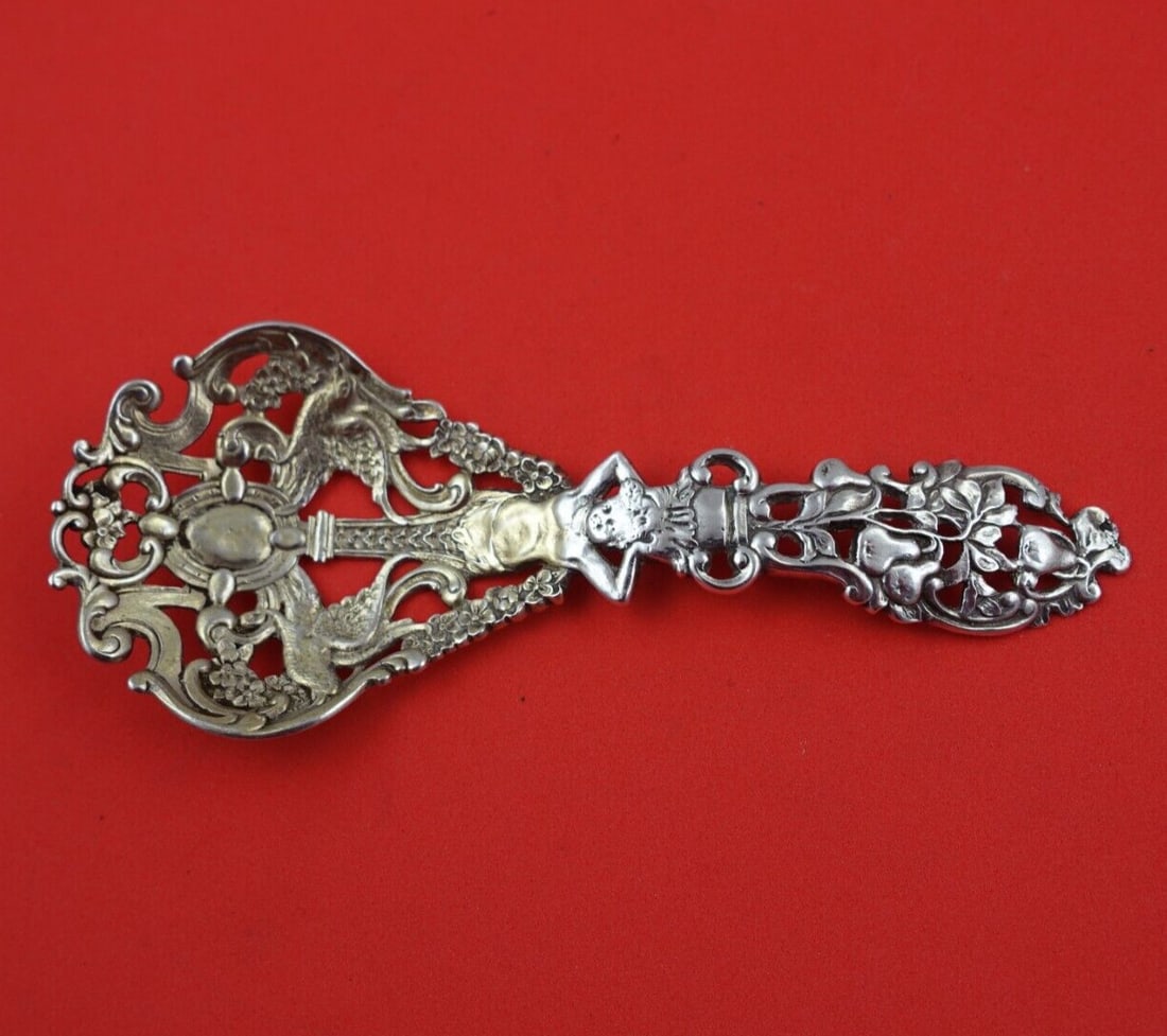 Gorham Sterling Silver Nut Spoon Pattern 591 Birds Pear Tree 4 7/8": Gorham Sterling Silver Nut Spoon Pattern 591 Birds Pear Tree 4 7/8" This exquisite nut spoon, crafted by Gorham, showcases the intricate pattern number 591. Made from high-quality sterling silver, it