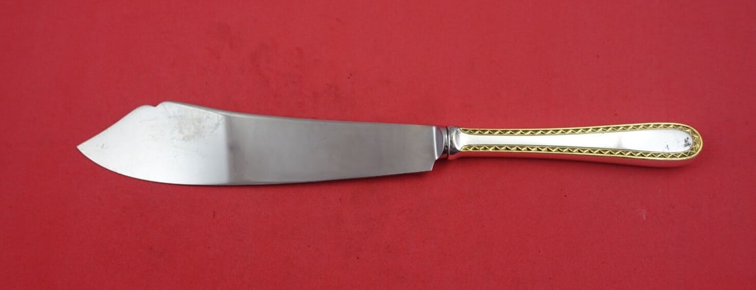 Kirk Golden Winslow Sterling Silver Cake Server 10.5": Kirk Golden Winslow Sterling Silver Cake Server 10.5" This exquisite Golden Winslow Cake Server from Kirk is a stunning piece crafted from sterling silver. The design features a unique combination of