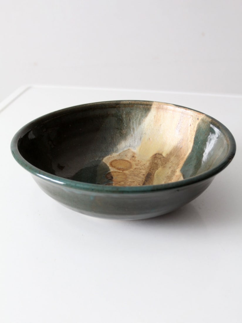 Vintage Sculptural Pottery Bowl with Variegated Glaze 11.5 inch: Vintage Sculptural Pottery Bowl with Variegated Glaze 11.5 inch This vintage studio pottery bowl features a unique sculptural form and an eye-catching variegated glaze. The interior showcases a harmon