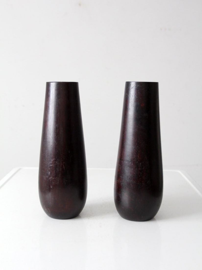 Mid-Century Vintage Wooden Vases with Glass Inserts Pair: Mid-Century Vintage Wooden Vases with Glass Inserts Pair This pair of vintage wooden vases features a tall, tapered design with a smooth dark brown finish, reflecting a mid-century minimalist aestheti