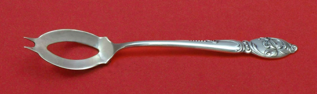 Westmorland Sterling Silver Enchanting Orchid Olive Spoon 5 3/4" Custom Serving Piece: Westmorland Sterling Silver Enchanting Orchid Olive Spoon 5 3/4" Custom Serving Piece This exquisite olive spoon from Westmorland is made from high-quality sterling silver and features the elegant Enc