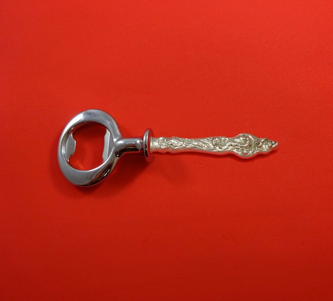 Reed & Barton Les Six Fleurs Sterling Silver Custom Bottle Opener 6": Reed & Barton Les Six Fleurs Sterling Silver Custom Bottle Opener 6" This elegant bottle opener is crafted from sterling silver and features a chrome-plated implement, showcasing the exquisite "Les Si