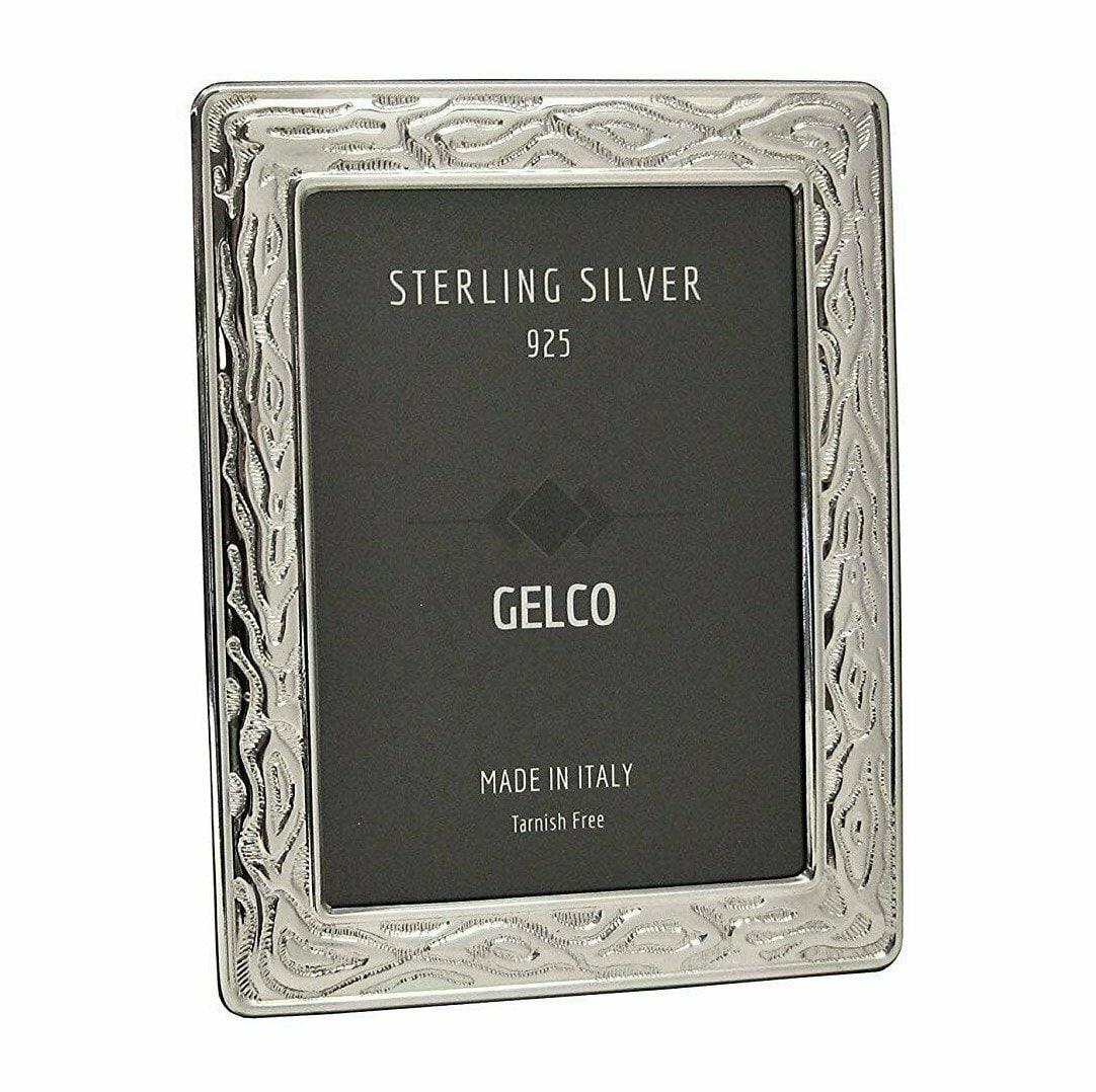 10 Inch 925 Sterling Silver Gelco Photo Frame With Wooden Back Design: 10 Inch 925 Sterling Silver Gelco Photo Frame With Wooden Back Design This Gelco picture frame features a 925 sterling silver front with a textured design and a wooden back. It is designed to hold and