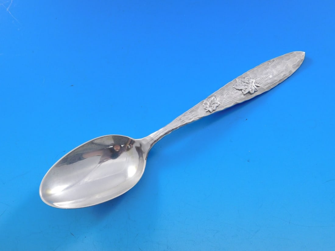 Tiffany & Co Lap Over Edge Sterling Silver Teaspoon with Maple Leaves: Tiffany & Co Lap Over Edge Sterling Silver Teaspoon with Maple Leaves This exquisite Lap Over Edge teaspoon by Tiffany & Co. showcases timeless elegance and craftsmanship. Made from sterling silver, t