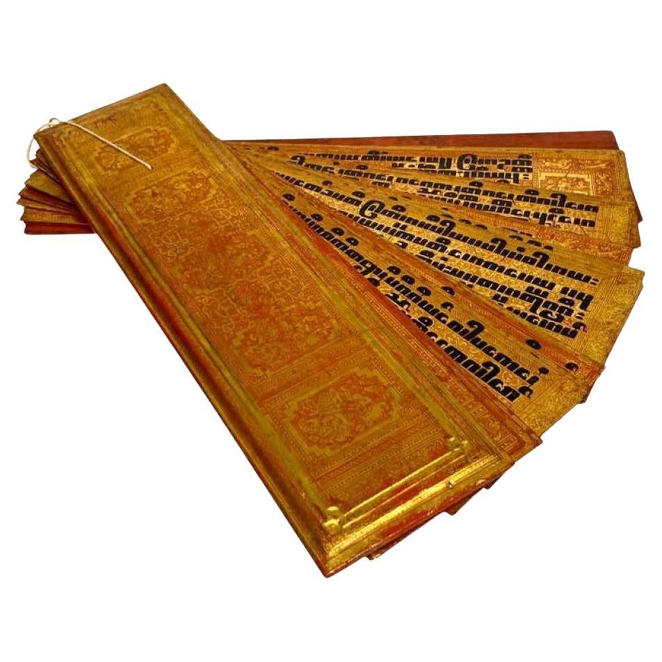 19th Century Burmese Kammavaca Manuscript with Gilt Lacquer Panels: 19th Century Burmese Kammavaca Manuscript with Gilt Lacquer Panels Discover an exceptional antique Burmese Kammavaca manuscript from the late 19th century, featuring 14 lacquered palm-leaf-style panel