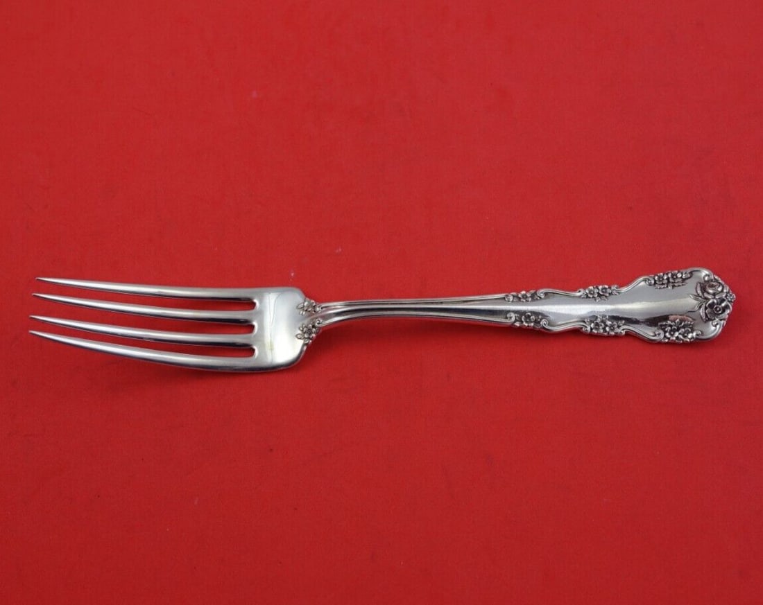 International Sterling Silver Wild Rose Old Dinner Fork 7.5" Flatware: International Sterling Silver Wild Rose Old Dinner Fork 7.5" Flatware This exquisite dinner fork is part of the Wild Rose Old pattern, also known as Rosalind Old, manufactured by International Sterlin