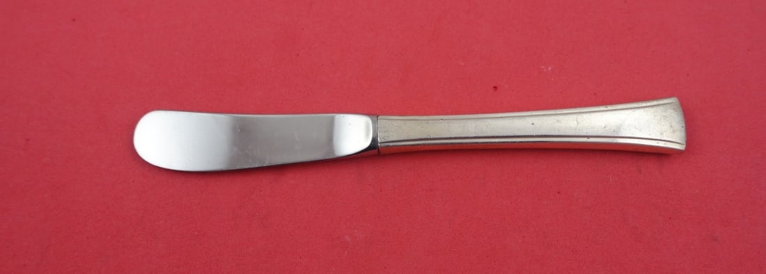 International Tranquility Sterling Silver Butter Spreader 6 1/8": International Tranquility Sterling Silver Butter Spreader 6 1/8" This exquisite butter spreader is part of the Tranquility pattern by International. Crafted from high-quality sterling silver, this hol