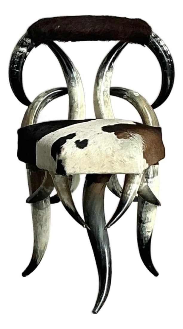 Horn and Cowhide Accent Chair with Boho Chic Vintage Style: Horn and Cowhide Accent Chair with Boho Chic Vintage Style This vintage Boho Chic chair features a distinctive design crafted with genuine horns forming the backrest and frame, and a seat upholstered