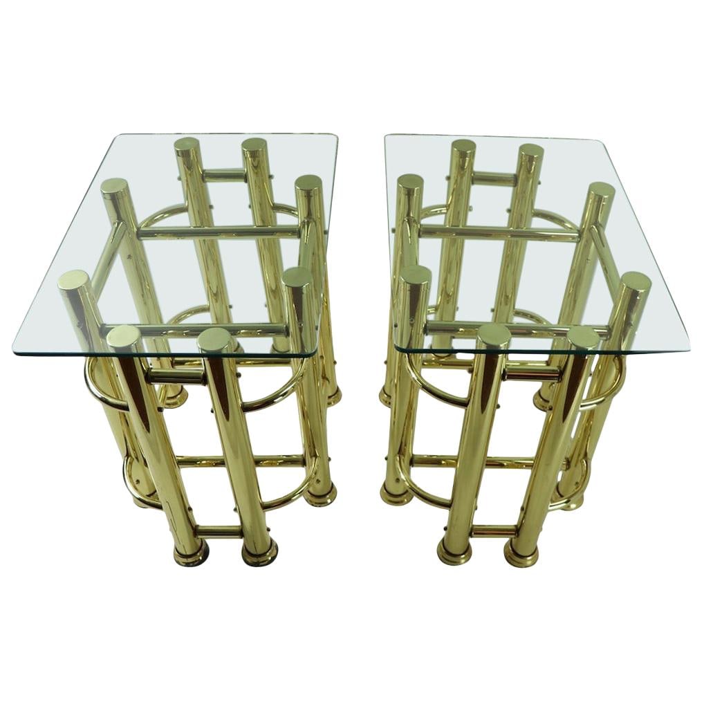 Chic Pair of 1970s Brass and Glass End Tables: Chic Pair of 1970s Brass and Glass End Tables This stylish pair of tubular brass and glass end tables showcases a sleek architectural constructivist design. Each table features a sturdy brass base wit
