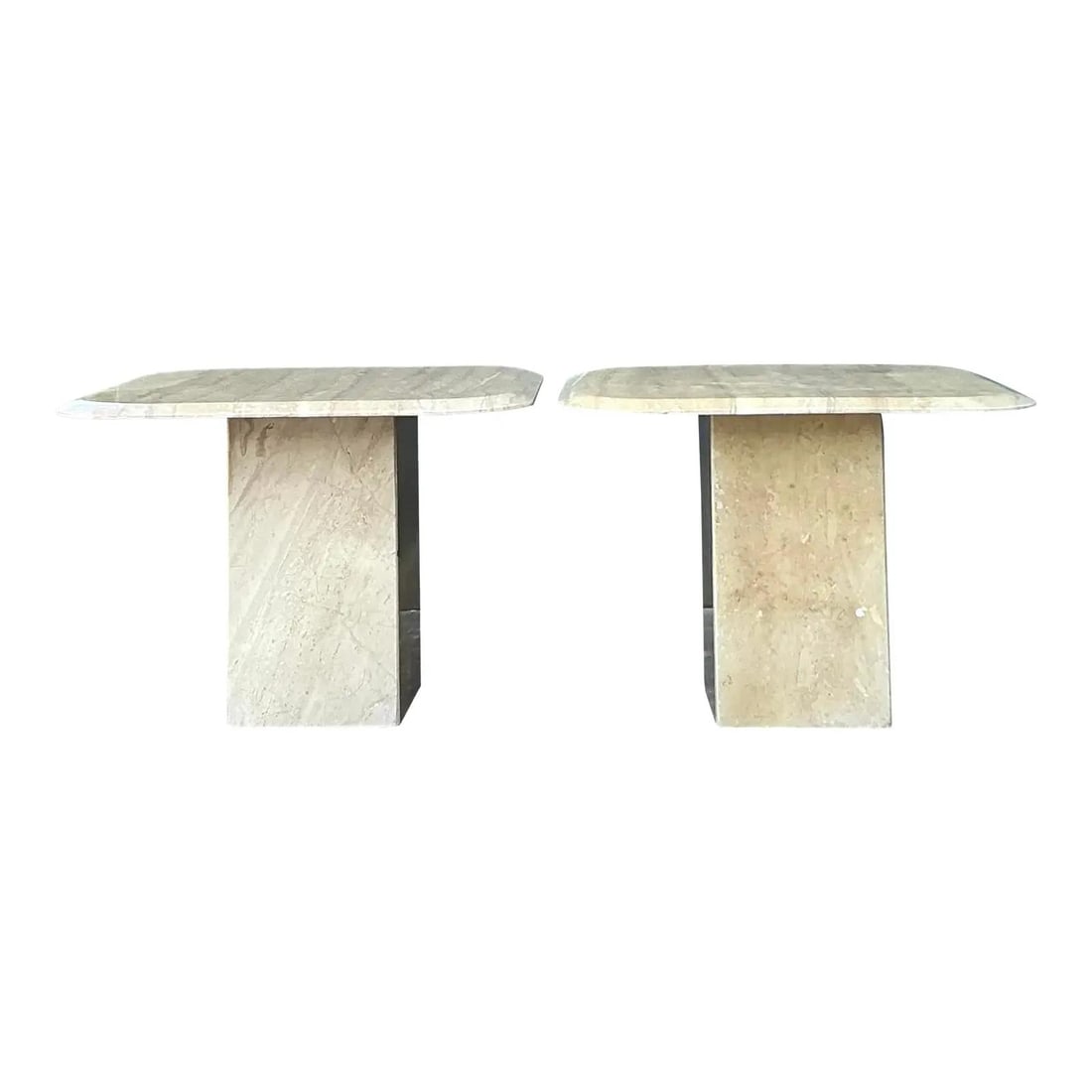 Pair of Postmodern Travertine Pedestal Side Tables with Bullnose Edges: Pair of Postmodern Travertine Pedestal Side Tables with Bullnose Edges This pair of vintage side tables showcases Postmodern style with a focus on architectural minimalism. Each table is crafted from