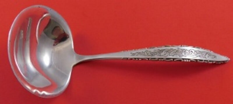 Lunt Floral Lace Sterling Silver Gravy Ladle 6.25 Inch: Lunt Floral Lace Sterling Silver Gravy Ladle 6.25 Inch This exquisite gravy ladle from Lunt features the elegant Floral Lace pattern. Crafted from heirloom-quality sterling silver, this ladle measures