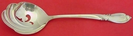 International Sterling Silver Rhapsody New Slotted Serving Spoon 8": International Sterling Silver Rhapsody New Slotted Serving Spoon 8" This exquisite serving spoon features the elegant Rhapsody New pattern by International Sterling. Crafted from high-quality