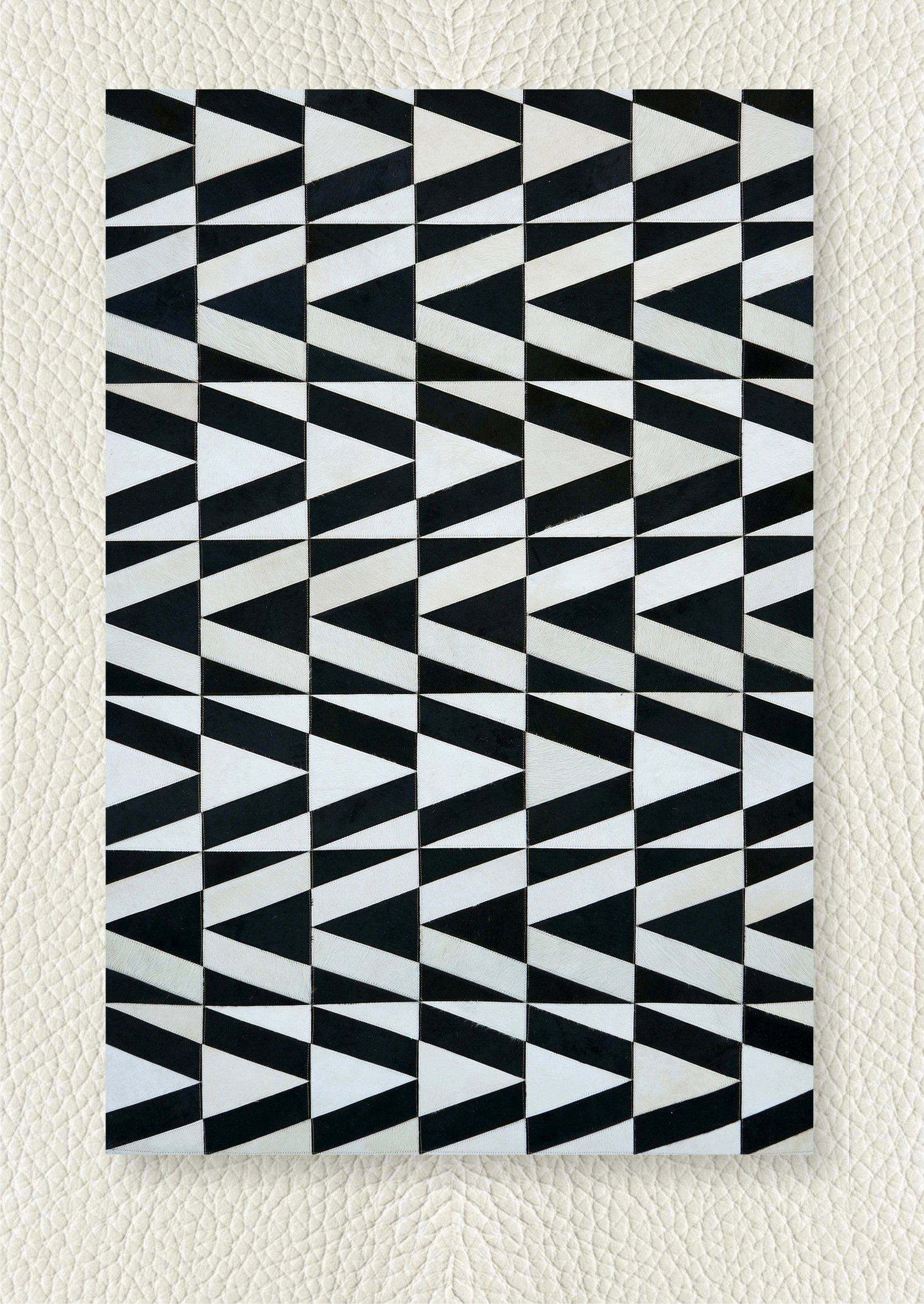 Monochrome Chevron Patchwork Cowhide Leather Rug 3FT x 5FT: Monochrome Chevron Patchwork Cowhide Leather Rug 3FT x 5FT Free continental US Shipping This monochrome abstract chevron mosaic patchwork rug is expertly handcrafted from premium hair-on cowhide leath