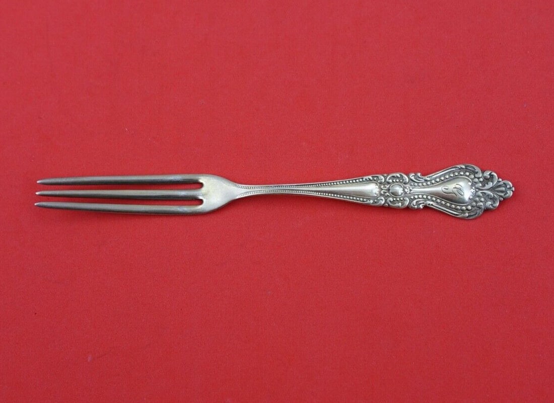 F.S. Gilbert Sterling Silver Monogrammed Strawberry Fork 5 in: F.S. Gilbert Sterling Silver Monogrammed Strawberry Fork 5 in This exquisite sterling silver strawberry fork from F.S. Gilbert is a charming addition to any table setting. Measuring 5 inches in length