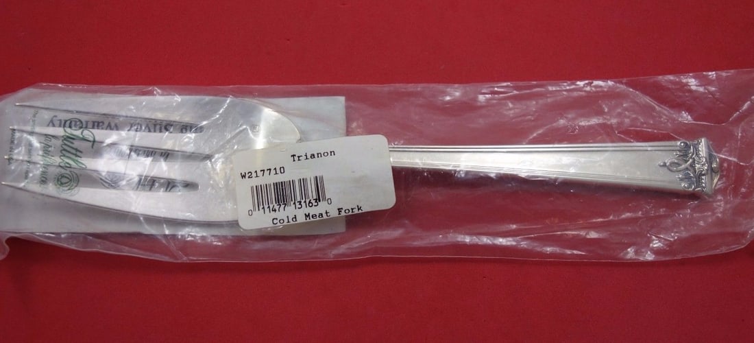 Trianon by Tuttle Sterling Silver Serving Fork 8 3/4" New in Sleeve: Trianon by Tuttle Sterling Silver Serving Fork 8 3/4" New in Sleeve This exquisite serving fork, part of the Trianon collection by Tuttle, is crafted from high-quality sterling silver. Measuring 8 3/4
