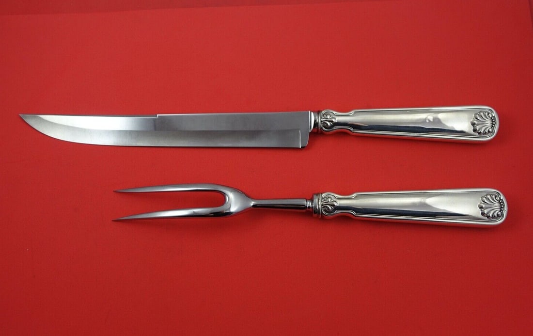 Tiffany and Co Shell and Thread Sterling Silver Carving Set 2-Piece: Tiffany and Co Shell and Thread Sterling Silver Carving Set 2-Piece This exquisite 2-piece roast carving set from Tiffany & Co. features the elegant Shell & Thread pattern. Crafted from high-quality s