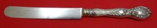 Sterling Silver Dinner Knife in La Parisienne Pattern 9 3/4 Inch: Sterling Silver Dinner Knife in La Parisienne Pattern 9 3/4 Inch This is a Reed & Barton La Parisienne dinner knife featuring a sterling silver hollow handle with a blunt blade. The knife measures 9 3
