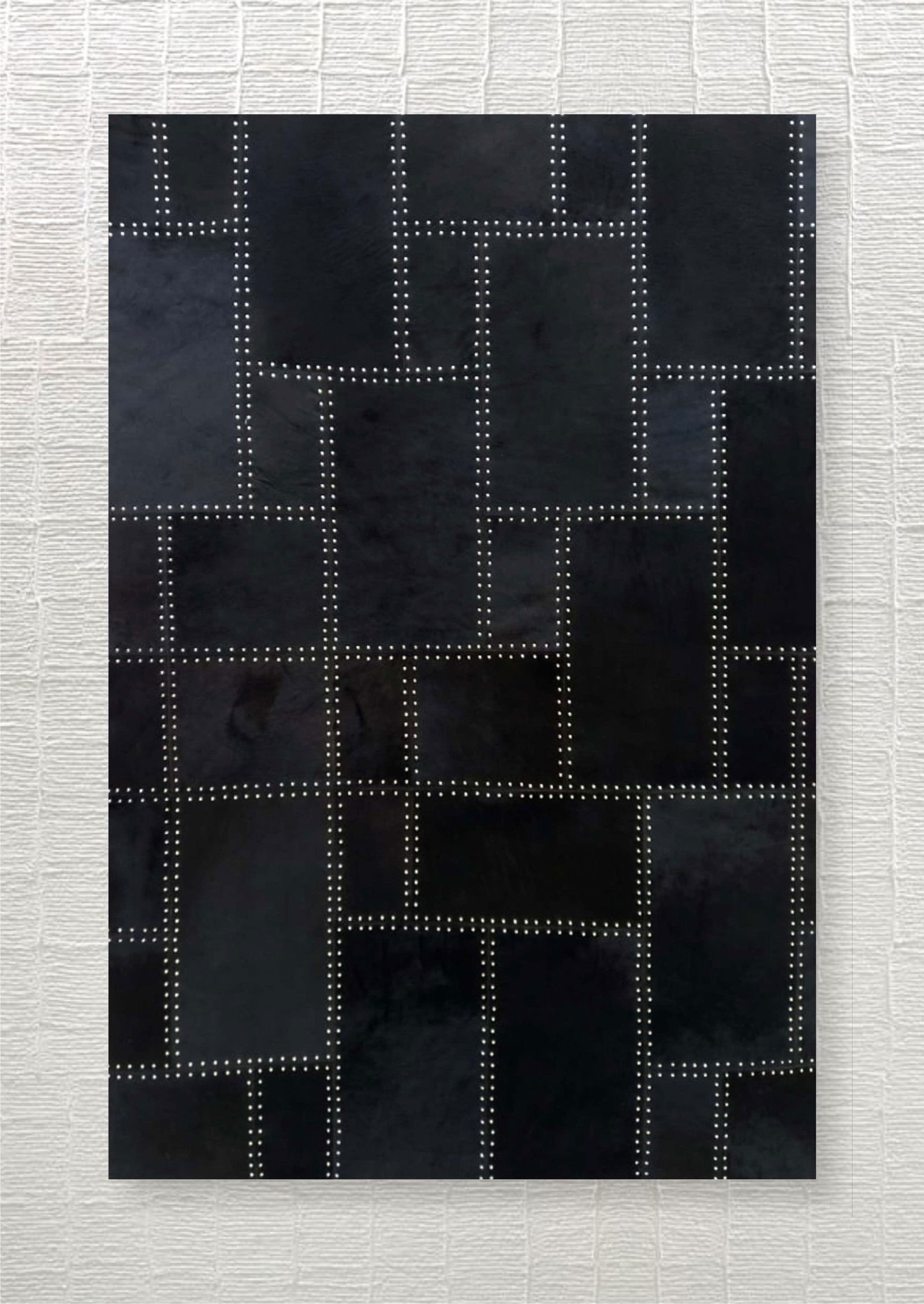 Midnight Black Studded Patchwork Cowhide Leather Area Rug 3FT x 5FT: Midnight Black Studded Patchwork Cowhide Leather Area Rug 3FT x 5FT Free continental US Shipping This area rug features a bold midnight black color with a geometric patchwork design, accented by metal