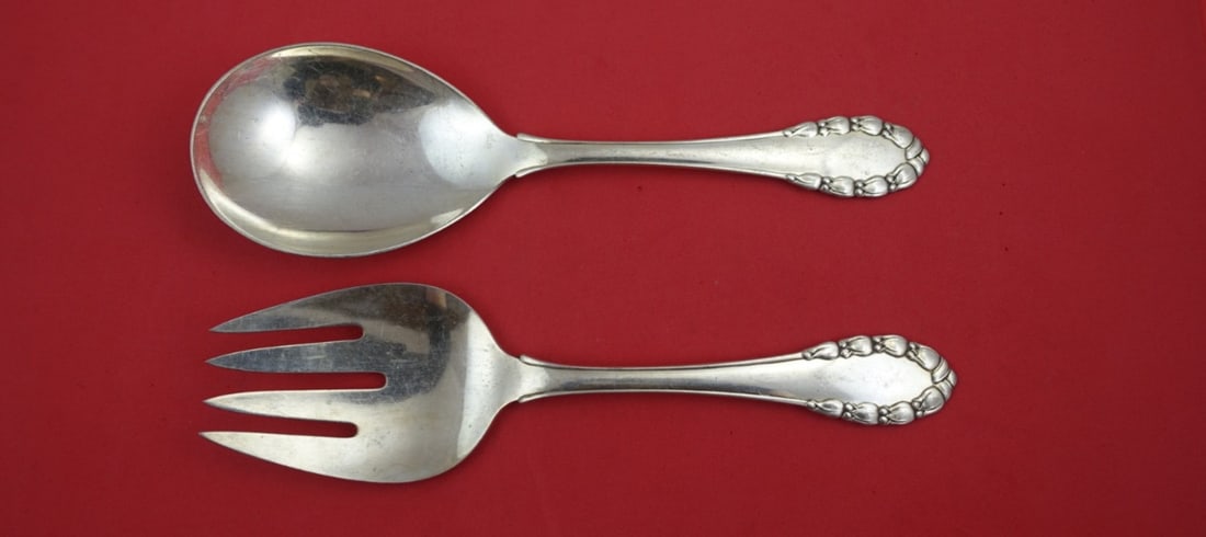 Georg Jensen Lily of the Valley Sterling Silver Salad Serving Set 9": Georg Jensen Lily of the Valley Sterling Silver Salad Serving Set 9" This exquisite Lily of the Valley salad serving set by Georg Jensen is crafted from high-quality sterling silver. The set features