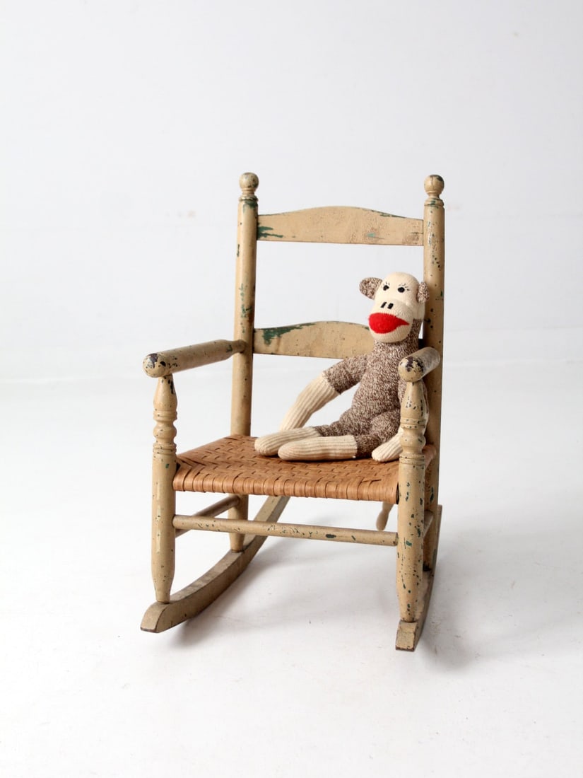 Antique Children's Rocking Chair Cream Wood Splint Weave Seat: Antique Children's Rocking Chair Cream Wood Splint Weave Seat This charming antique children's rocking chair showcases a painted cream wood ladder back design and features a beautifully woven splint s