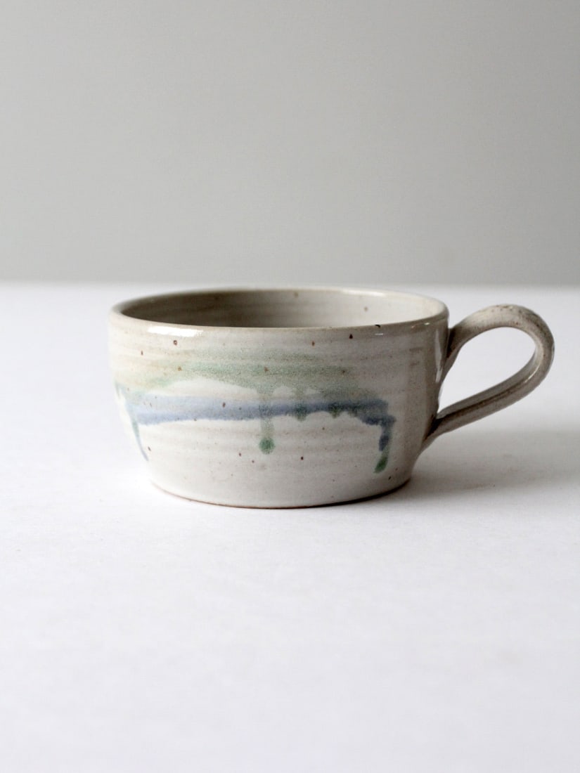 Handmade Vintage Studio Pottery Bowl with Sieve Signature: Handmade Vintage Studio Pottery Bowl with Sieve Signature Discover this charming vintage studio pottery bowl, elegantly designed with a colander or sieve front. This handmade piece is signed by the ar