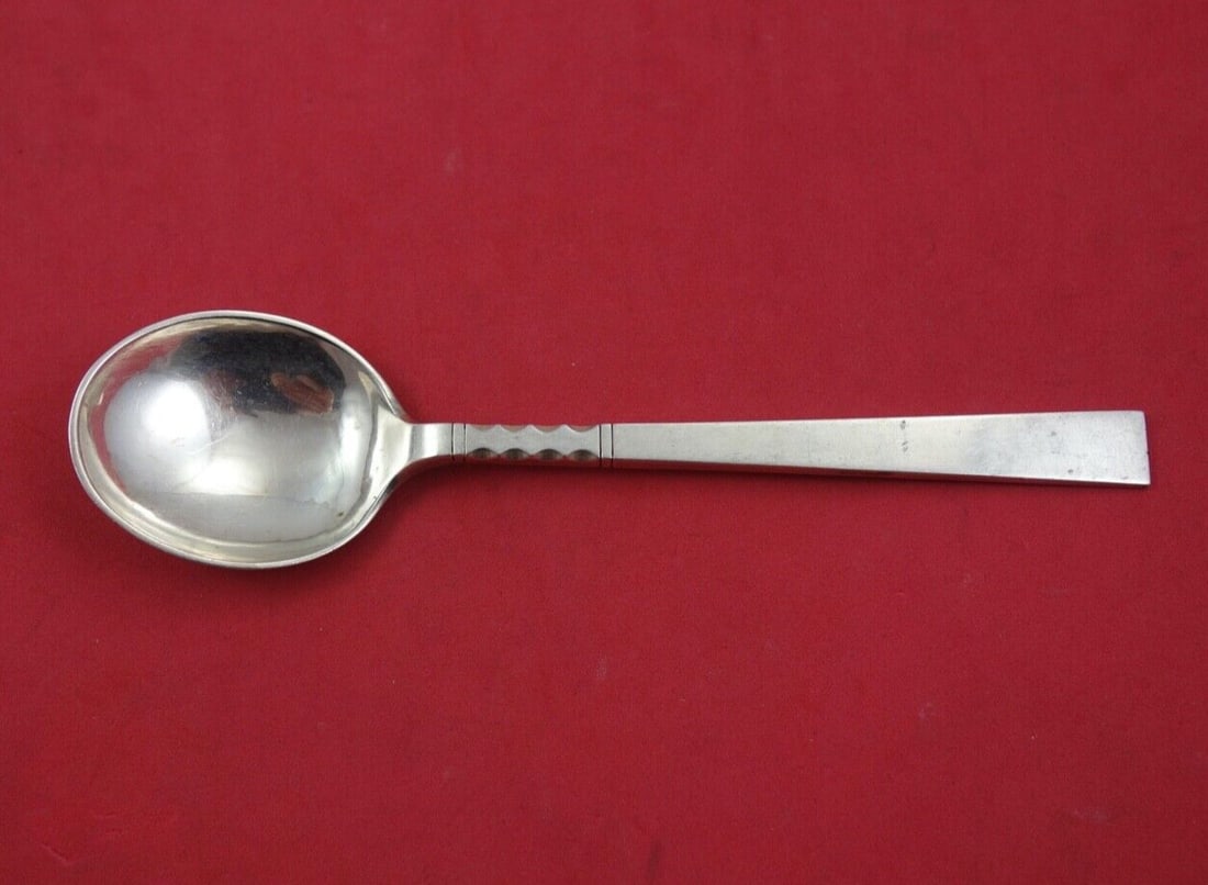 John Petterson Neptune Sterling Silver Cream Soup Spoon 6.5": John Petterson Neptune Sterling Silver Cream Soup Spoon 6.5" Enhance your dining experience with this exquisite 6 1/2" cream soup spoon in the Neptune pattern by John Petterson. Crafted from high-qual