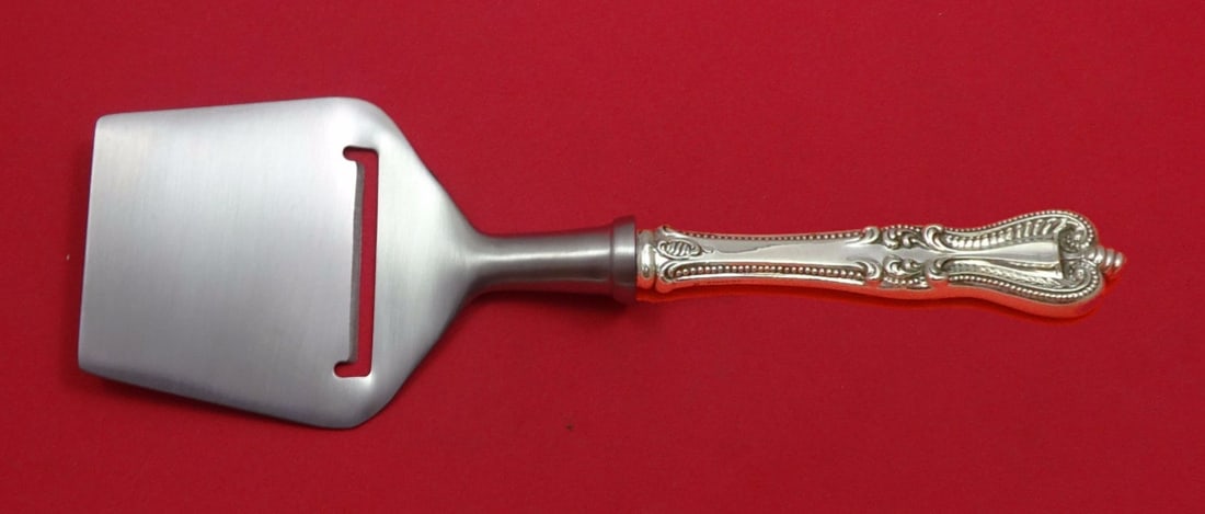 Towle Old Colonial Sterling Silver Cheese Plane Custom 8.25": Towle Old Colonial Sterling Silver Cheese Plane Custom 8.25" This exquisite cheese plane from the Old Colonial pattern by Towle features a flat stainless steel cutting blade with a matte finish, perfe