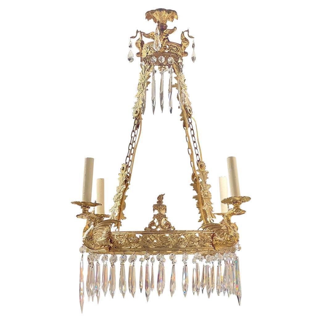 French Empire Gilt Bronze Four Candle Chandelier with Crystal Pendants Circa 1900: French Empire Gilt Bronze Four Candle Chandelier with Crystal Pendants Circa 1900 This late 19th century French Empire style chandelier is crafted from gilt bronze and features a circular form with