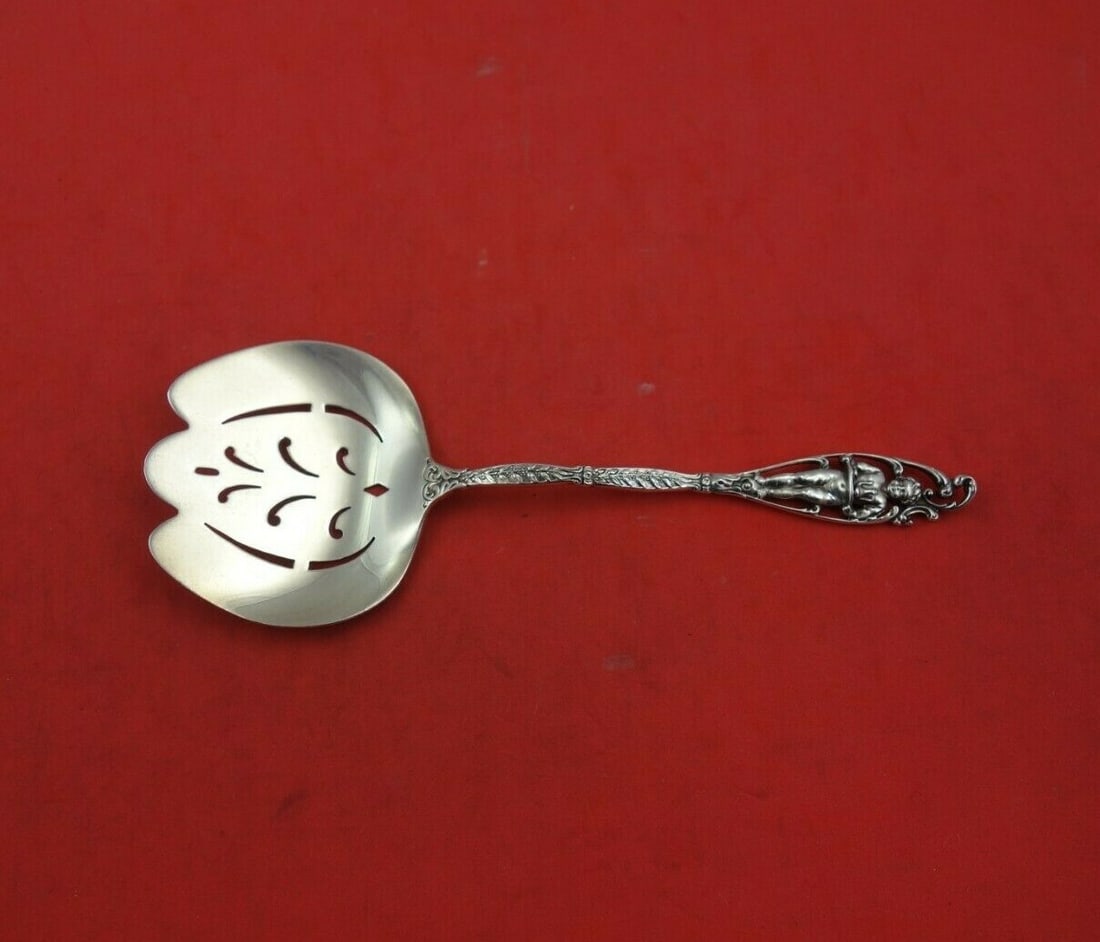 Dominick & Haff Sterling Silver Nut Spoon Labors of Cupid 5 3/4": Dominick & Haff Sterling Silver Nut Spoon Labors of Cupid 5 3/4" This exquisite nut spoon from the renowned maker Dominick & Haff features the charming "Labors of Cupid" pattern, showcasing intricate