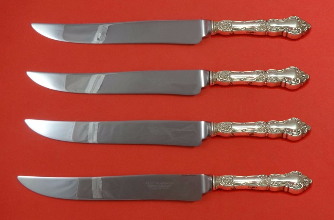Meadow Rose by Wallace Sterling Silver 4pc Texas Sized Steak Knife Set: Meadow Rose by Wallace Sterling Silver 4pc Texas Sized Steak Knife Set Introducing the Meadow Rose by Wallace Sterling Silver Steak Knife Set, a stunning addition to any dining experience. This 4-piec