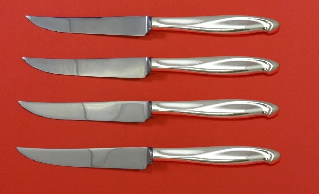 Reed & Barton Silver Sculpture Sterling Silver Steak Knife Set 4pc: Reed & Barton Silver Sculpture Sterling Silver Steak Knife Set 4pc Enhance your dining experience with this exquisite 4-piece Sterling Silver Steak Knife Set from Reed & Barton, featuring a stunning '