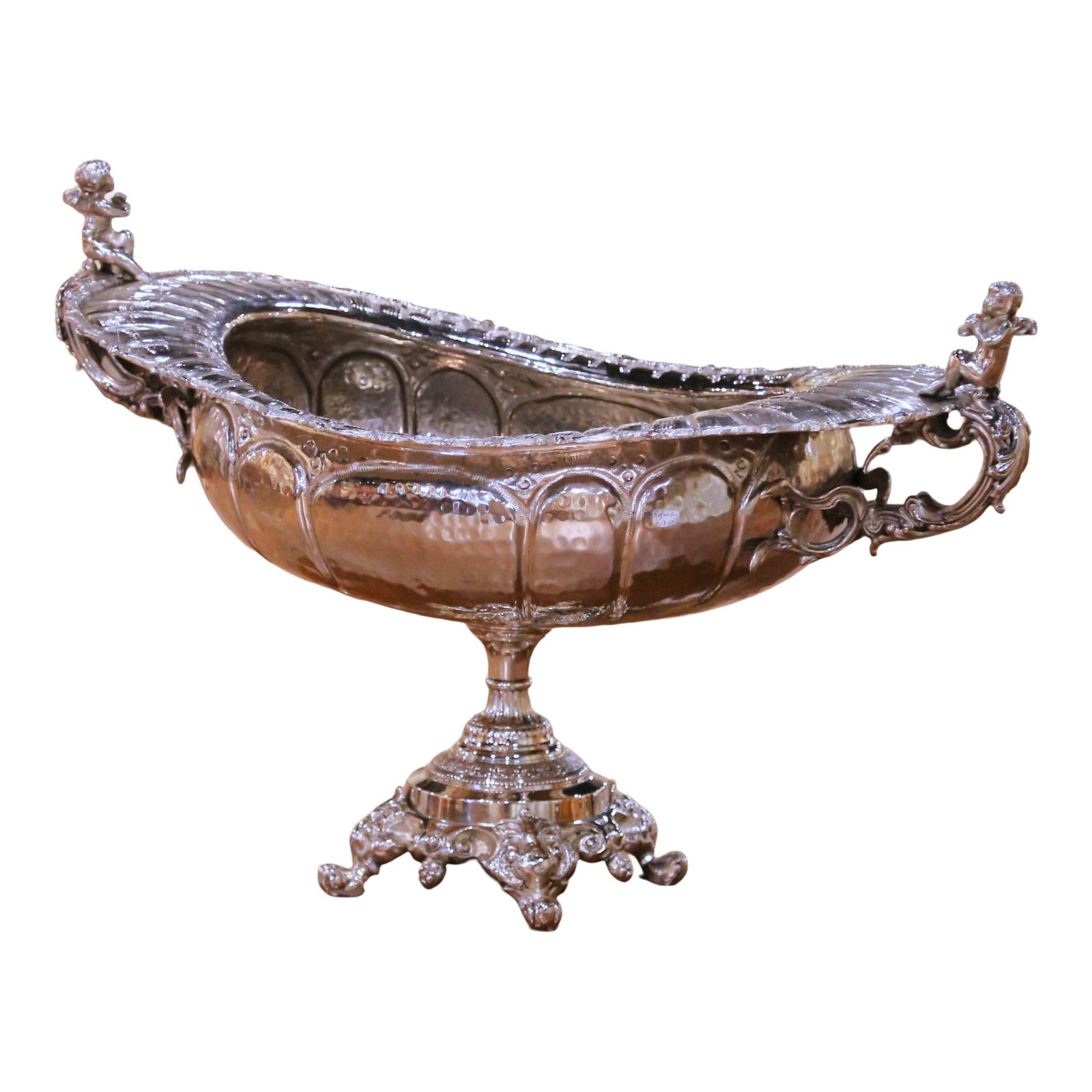 Silver Plate Rococo Wine Cooler with Putti Handles French Circa 2000: Silver Plate Rococo Wine Cooler with Putti Handles French Circa 2000 This large French Rococo style wine chiller, crafted circa 2000, features an elongated oval basin with a hammered body and a richly