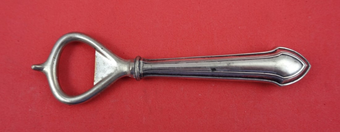 Durgin Essex Sterling Silver 5.25" Bottle Opener: Durgin Essex Sterling Silver 5.25" Bottle Opener This exquisite bottle opener from the Essex pattern by Durgin is crafted from sterling silver, featuring a hollow handle and a stainless steel implemen