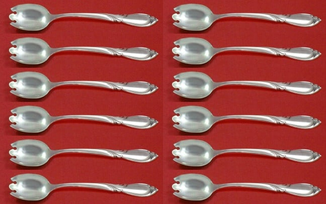 International Sterling Silver Rhapsody New Dessert Forks Set of 12: International Sterling Silver Rhapsody New Dessert Forks Set of 12 This exquisite set of 12 dessert forks features the elegant Rhapsody New pattern by International Sterling. Each fork measures 6 inch
