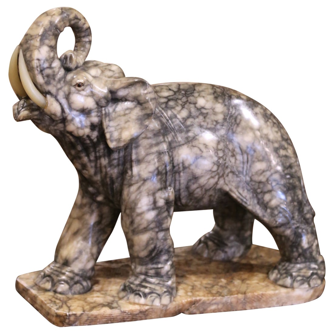 19th Century French Hand-Carved Marble Elephant Sculpture: 19th Century French Hand-Carved Marble Elephant Sculpture This exquisite sculpture features a 19th Century French carved elephant made from richly variegated marble, showcasing a stunning display of c