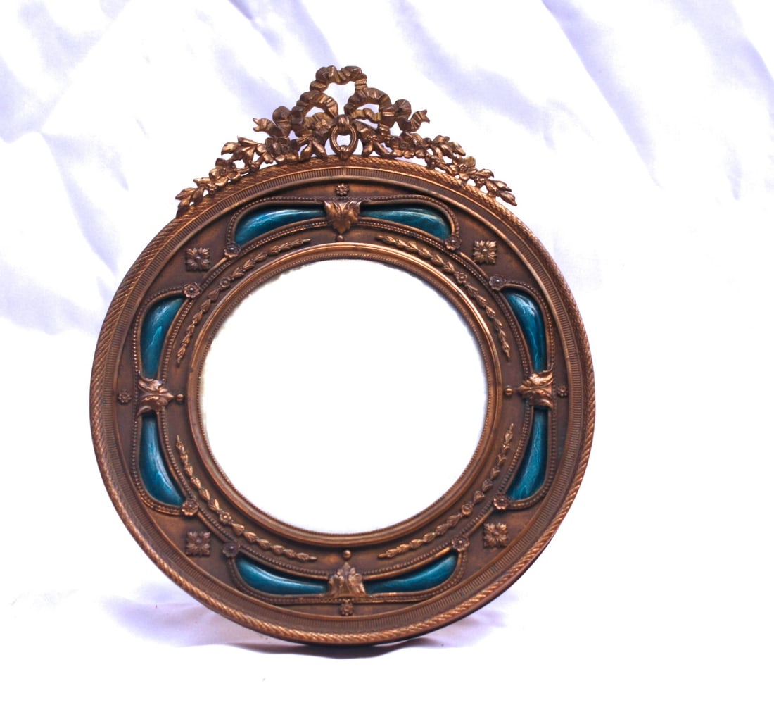 19th Century French Enameled Bronze Picture Frame 6.6 x 7.9: 19th Century French Enameled Bronze Picture Frame 6.6 x 7.9 This exquisite 19th-century French enameled bronze picture frame showcases remarkable detail and craftsmanship. Measuring 6.6" in width, 7.9