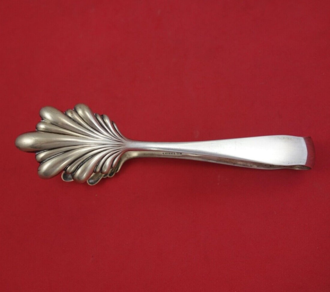 Kirk Stieff Wadefield Sterling Silver Ice Tongs Double Claw 6 1/4": Kirk Stieff Wadefield Sterling Silver Ice Tongs Double Claw 6 1/4" Enhance your serving experience with the Wadefield ice tongs by Kirk-Stieff, crafted from high-quality sterling silver. Featuring a d