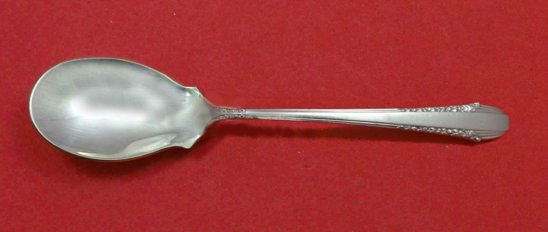 International Sterling Silver Enchantress Ice Cream Spoon Custom 5 3/4": International Sterling Silver Enchantress Ice Cream Spoon Custom 5 3/4" Indulge in the elegance of the Enchantress ice cream spoon, custom made in the exquisite pattern by International Sterling. This