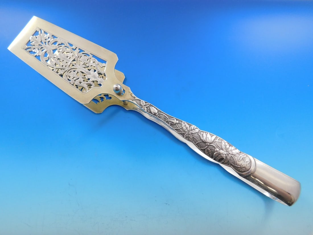 Knowles Sterling Silver Asparagus Tong Rose Pattern 11 3/4 Inch: Knowles Sterling Silver Asparagus Tong Rose Pattern 11 3/4 Inch Discover the exquisite craftsmanship of this sterling silver asparagus serving tong, designed in the elegant 'Rose' pattern by Knowles.