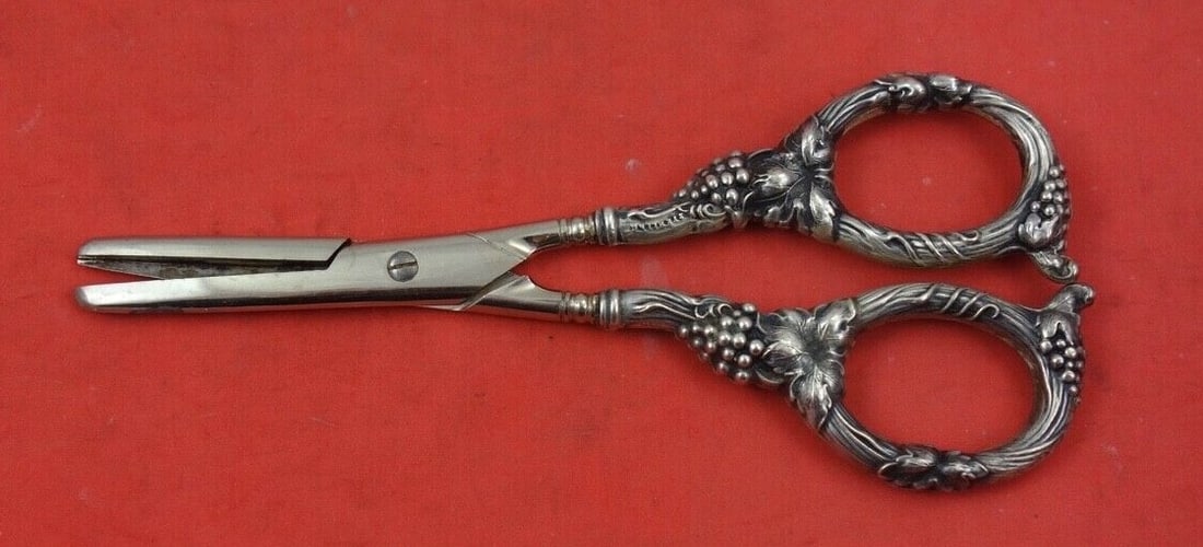 German Sterling Silver Grape Shears 6 1/8" Blade Needs Adjustment: German Sterling Silver Grape Shears 6 1/8" Blade Needs Adjustment These exquisite Sterling Silver Grape Shears feature a beautifully designed handle adorned with grape motifs, showcasing craftsmanship